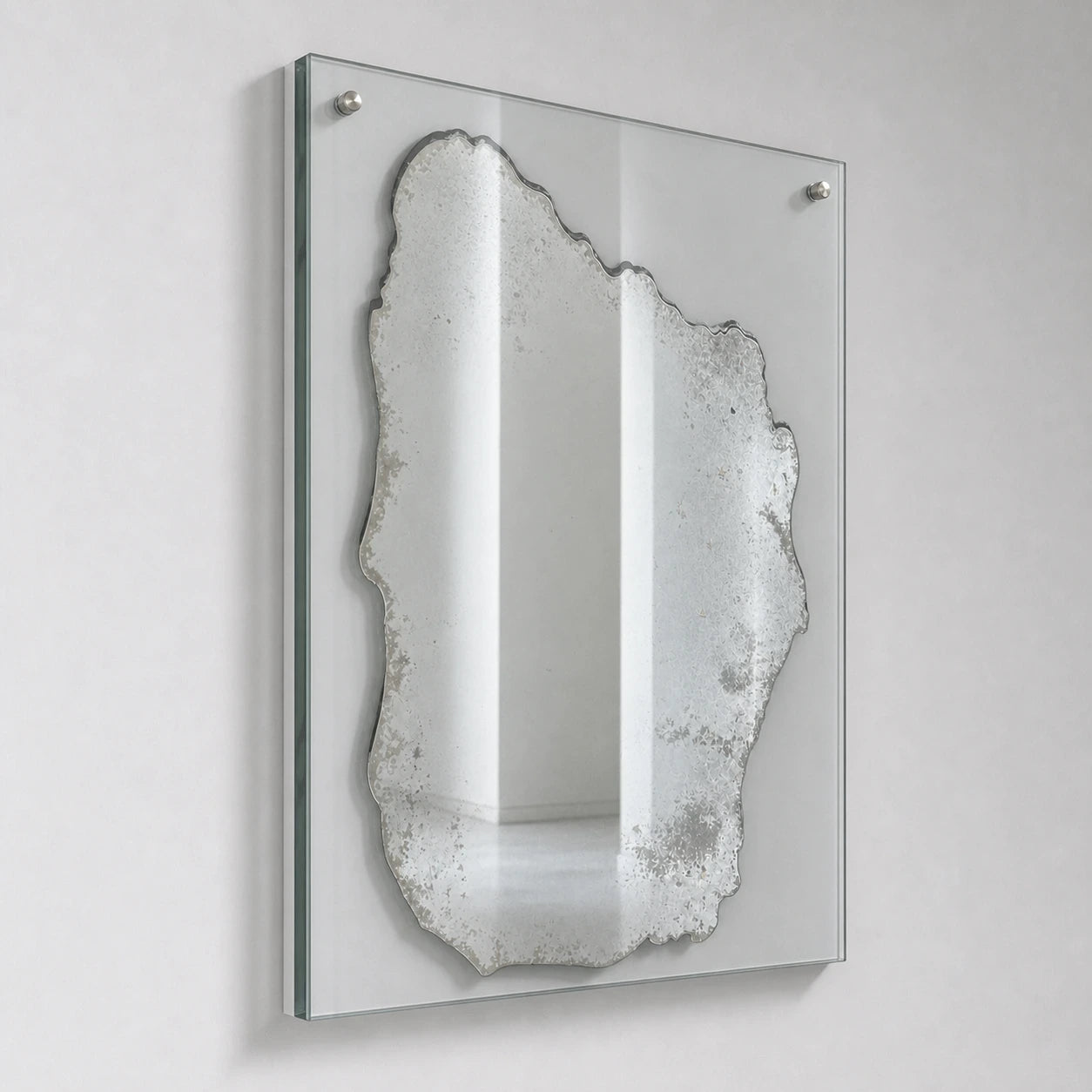 Distressed silver rectangular wall mirror on clear glass, left oblique view