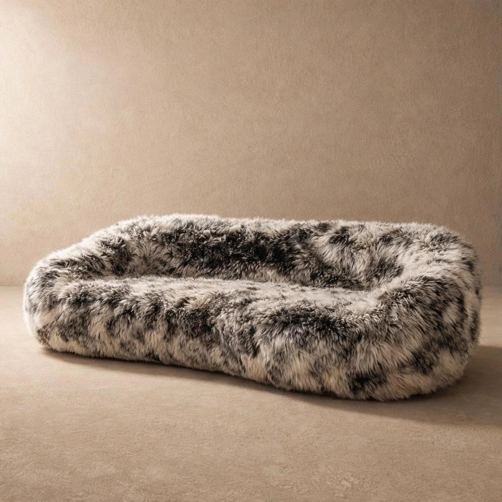 Black and white shaggy faux fur oval pod sofa, angled view
