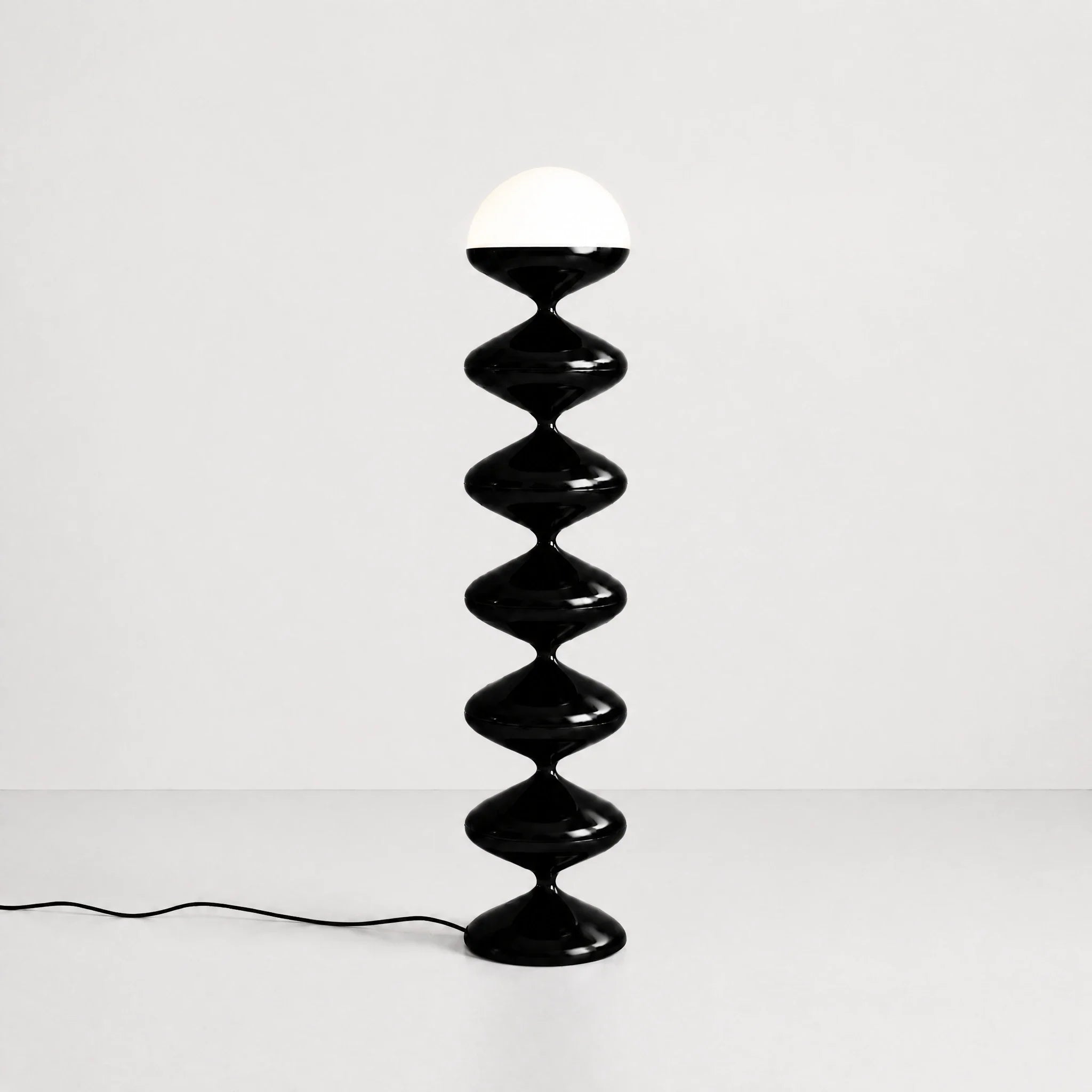 Black gourd floor lamp with stacked metal discs and frosted dome — view 2
