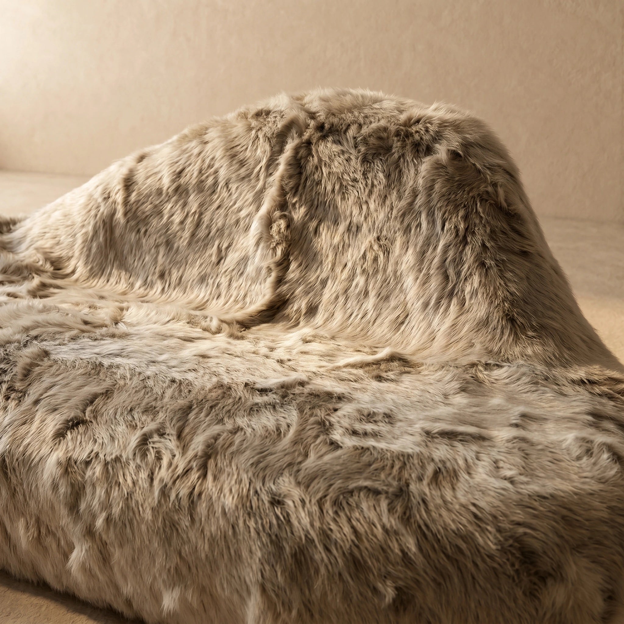 Ivory cream shaggy faux fur organic boulder sofa, sculptural form detail