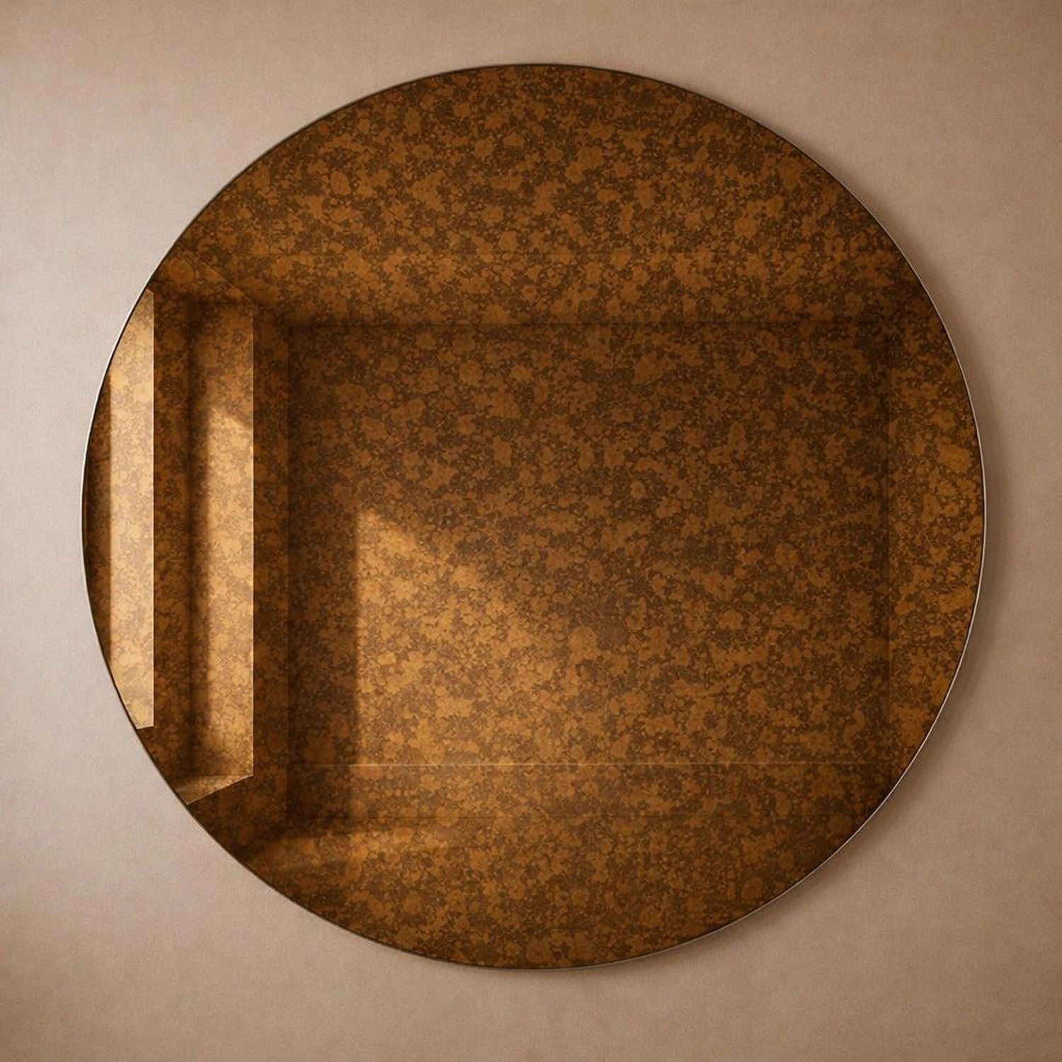 Amber cognac antiqued round wall mirror with warm mottled foxing, full frame