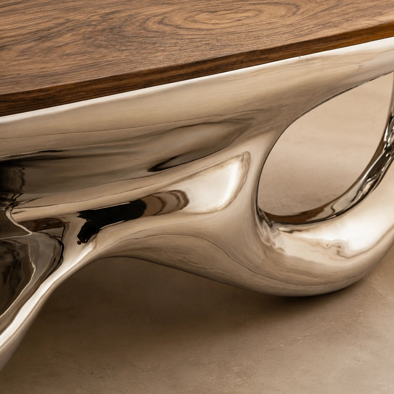 Mirror-polished chrome base detail of the Chrome Mirage coffee table