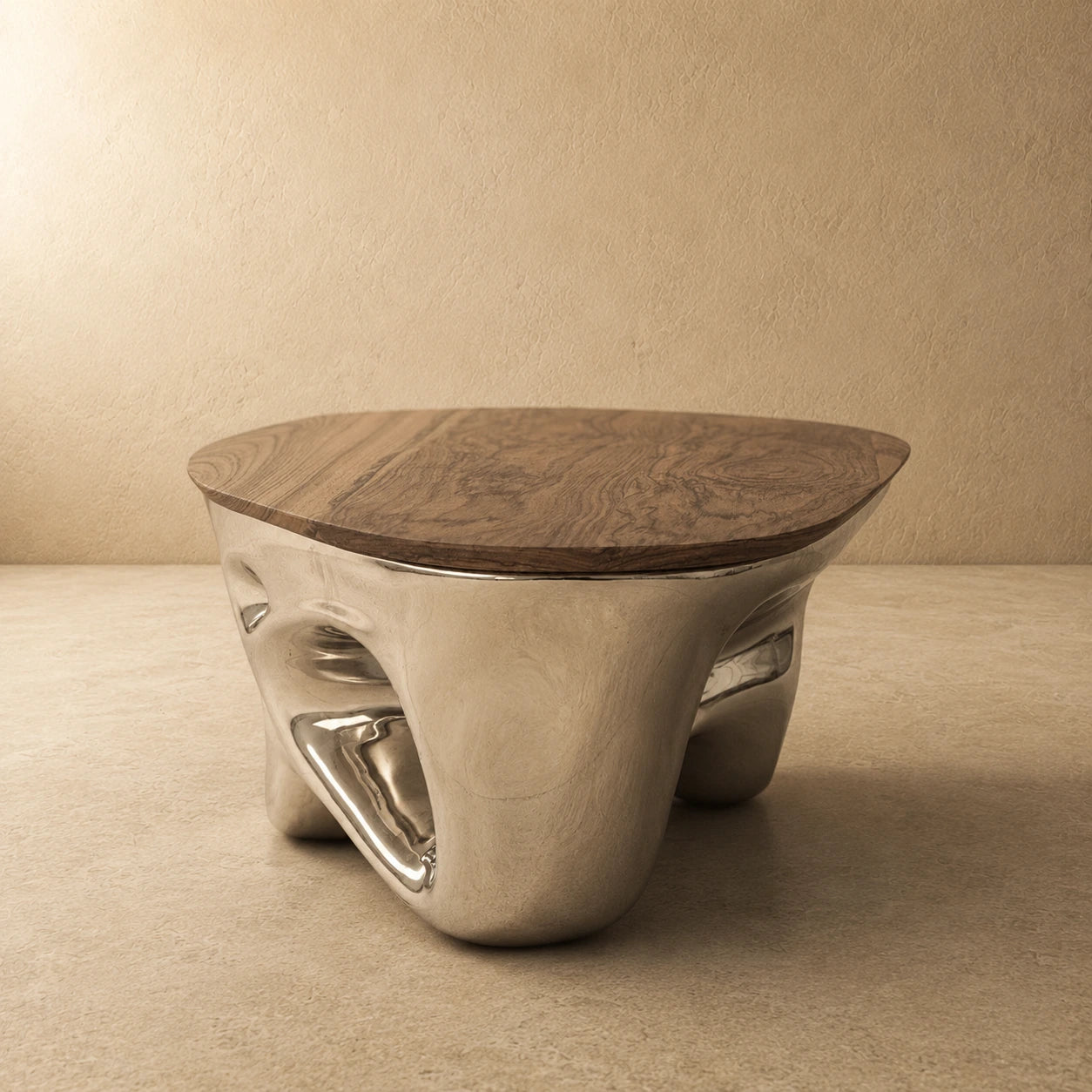 Side profile of the Chrome Mirage coffee table — low wide mirror-chrome base