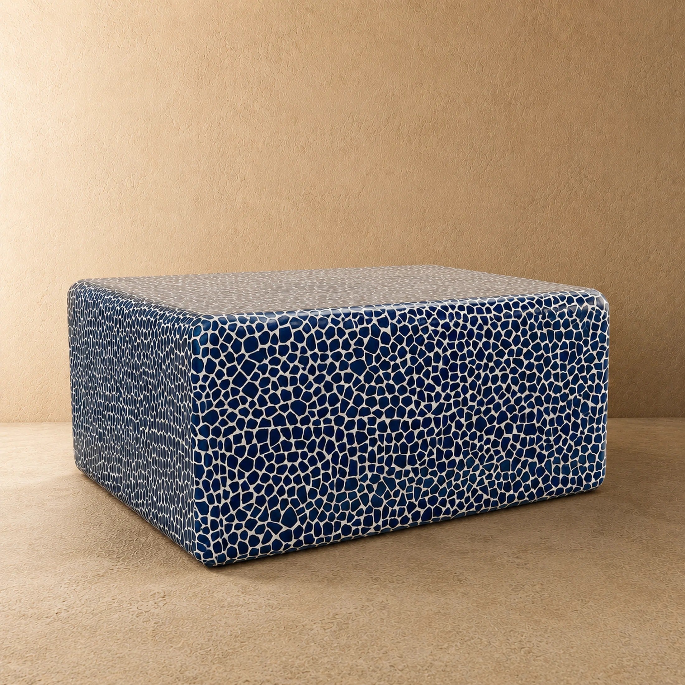 Blue and white mosaic coffee table, three-quarter view showing tiled top and side