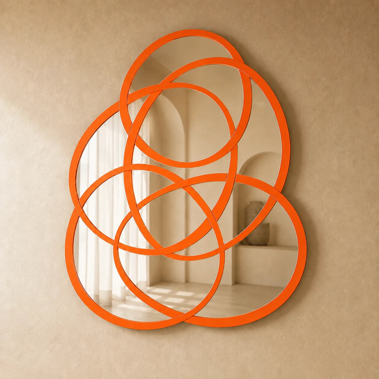 Rings of Infinity Wall Mirror in orange on a warm plaster wall