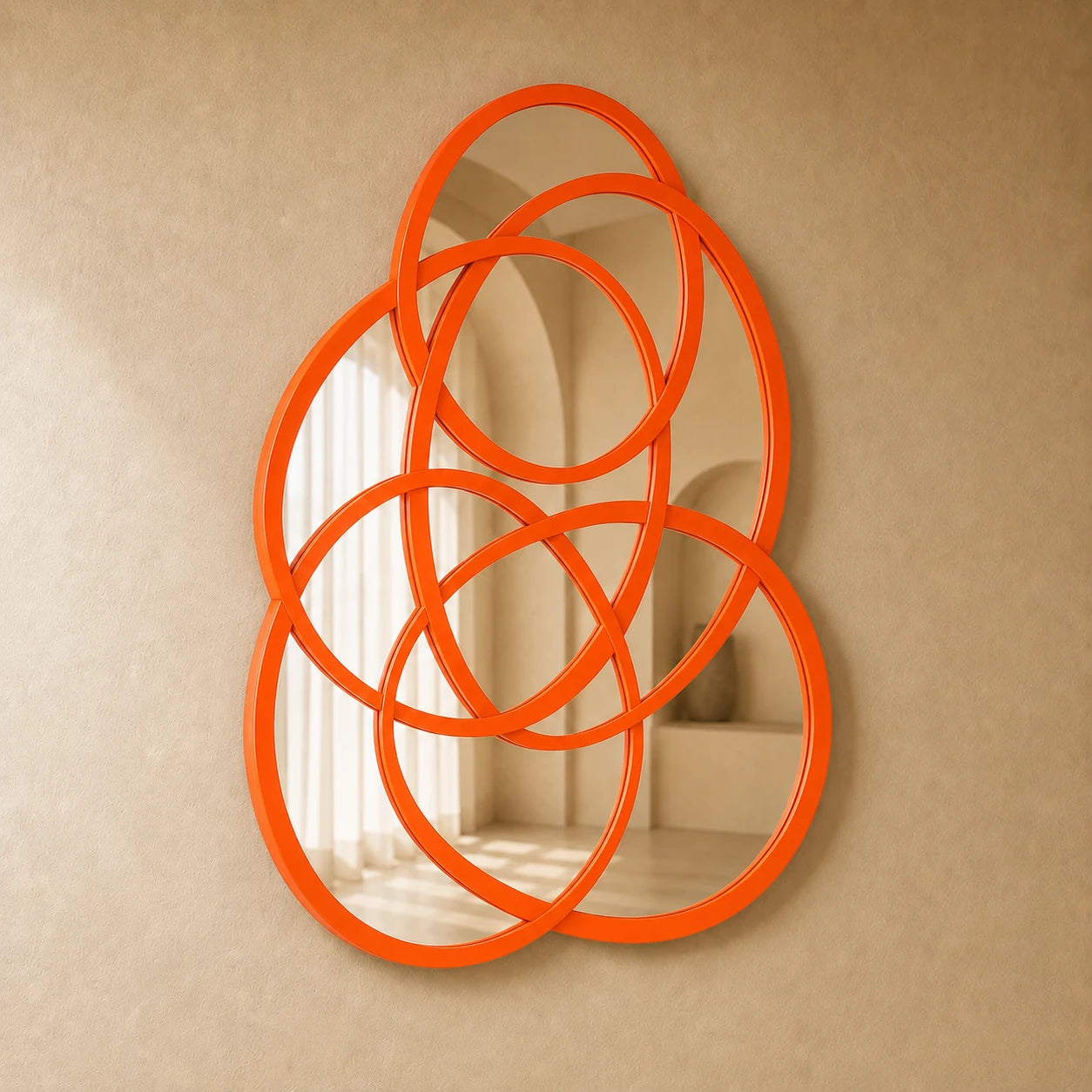 Rings of Infinity Wall Mirror in orange on a warm plaster wall
