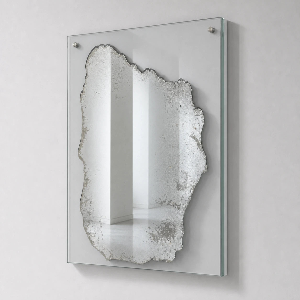 Distressed silver rectangular wall mirror on clear glass, right oblique view