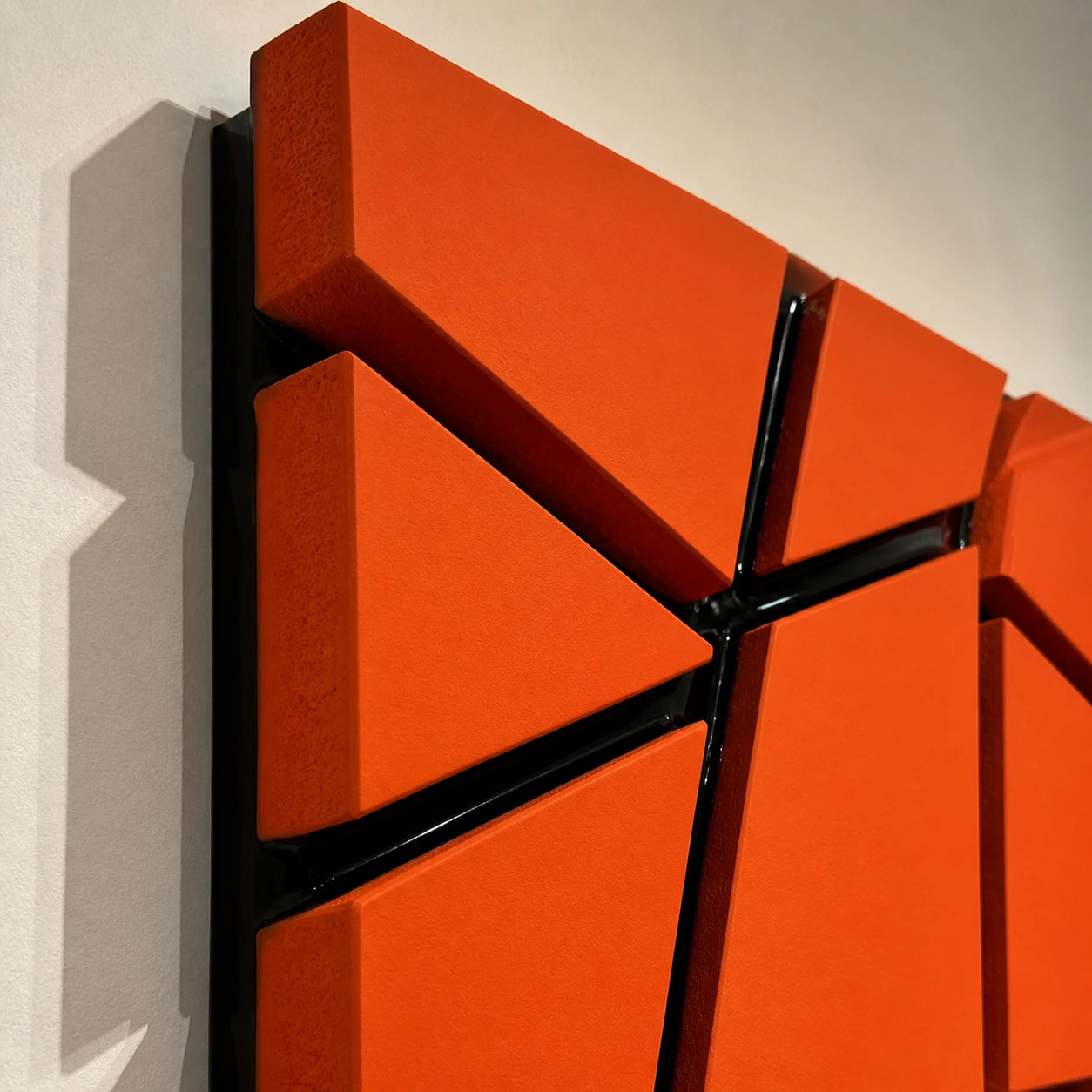 Intersect orange wall art close-up with raised blocks and black resin channels