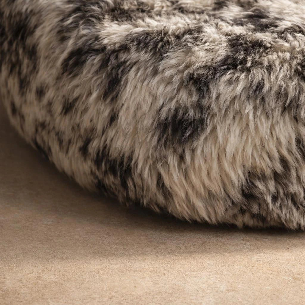 Black and white faux fur oval pod sofa, lower edge and fur detail