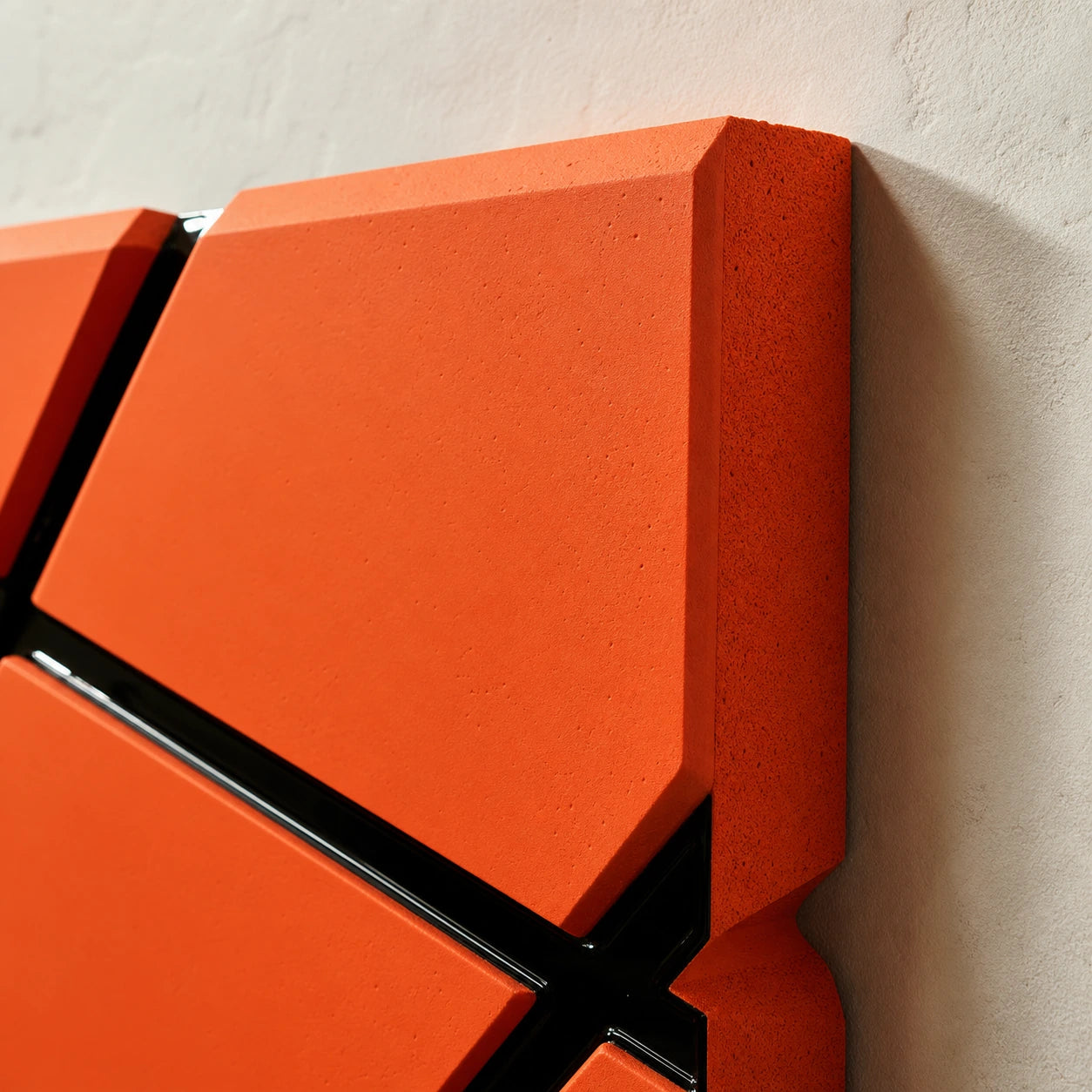 Intersect wall art edge detail with thick orange block and glossy black channel