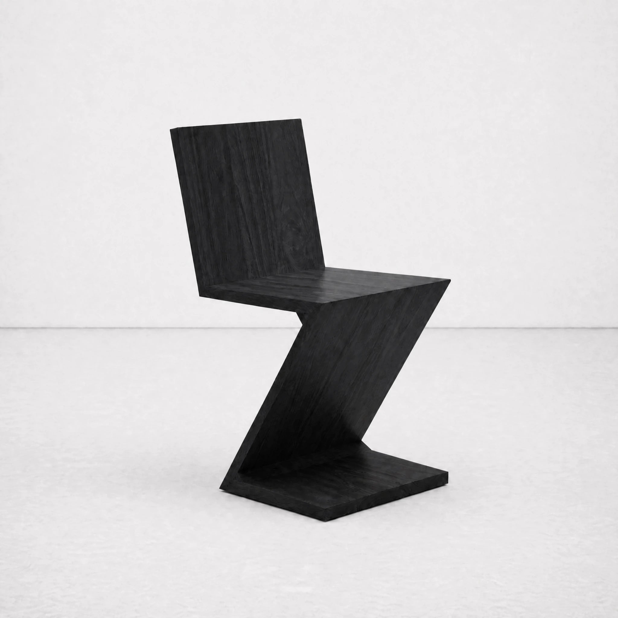 Black Zig Zag Chair side profile — cantilevered diagonal seat and back
