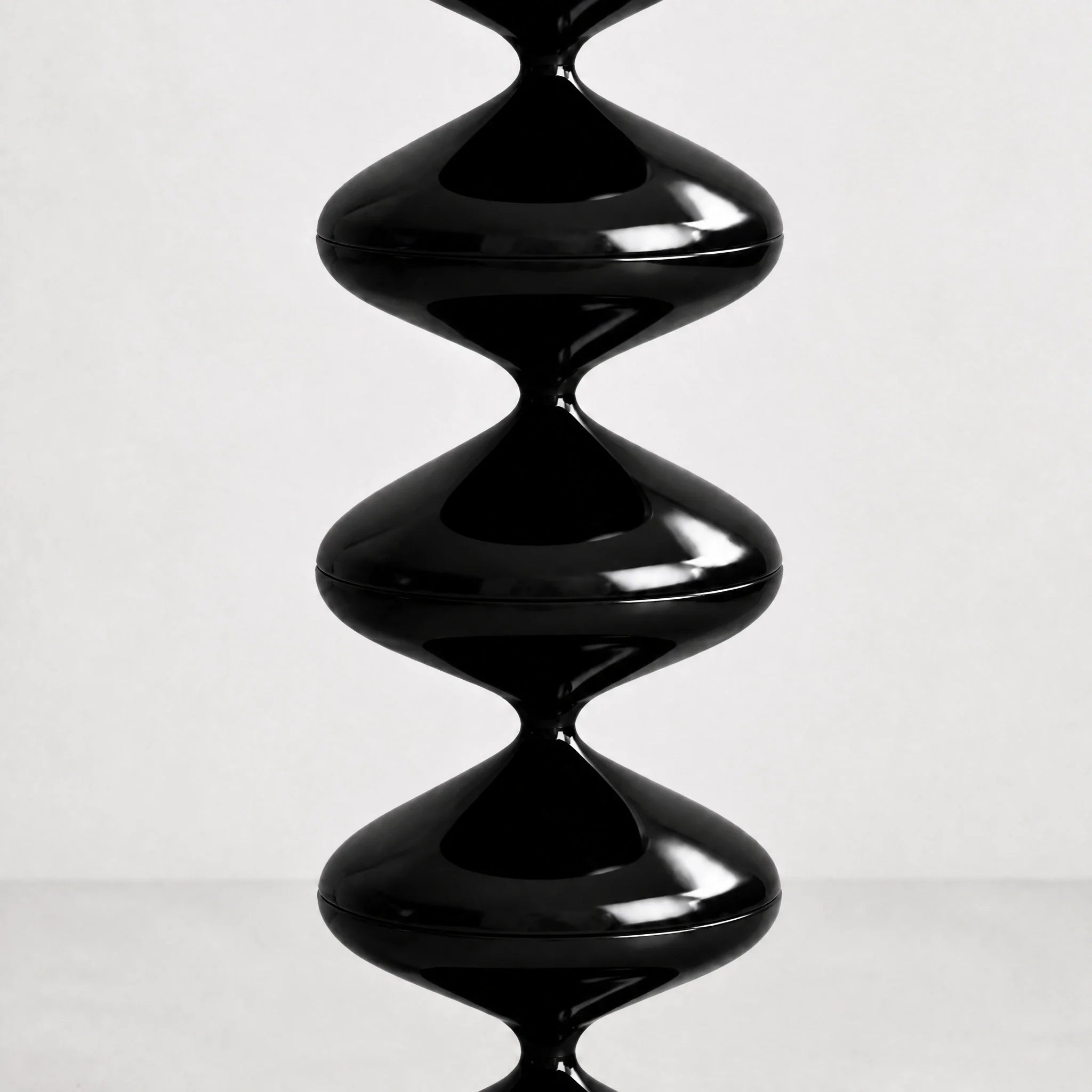 Black gourd floor lamp with stacked metal discs and frosted dome — view 1