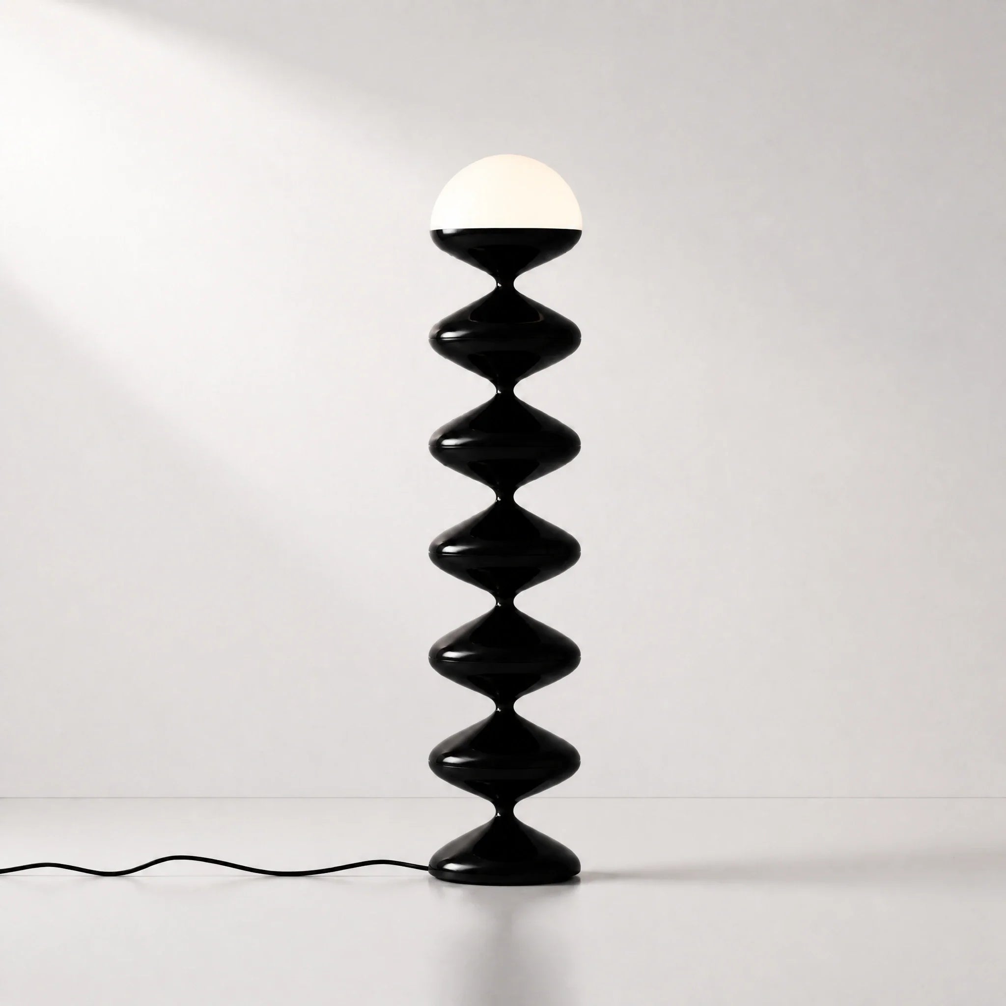 Black gourd floor lamp with stacked metal discs and frosted dome — view 4