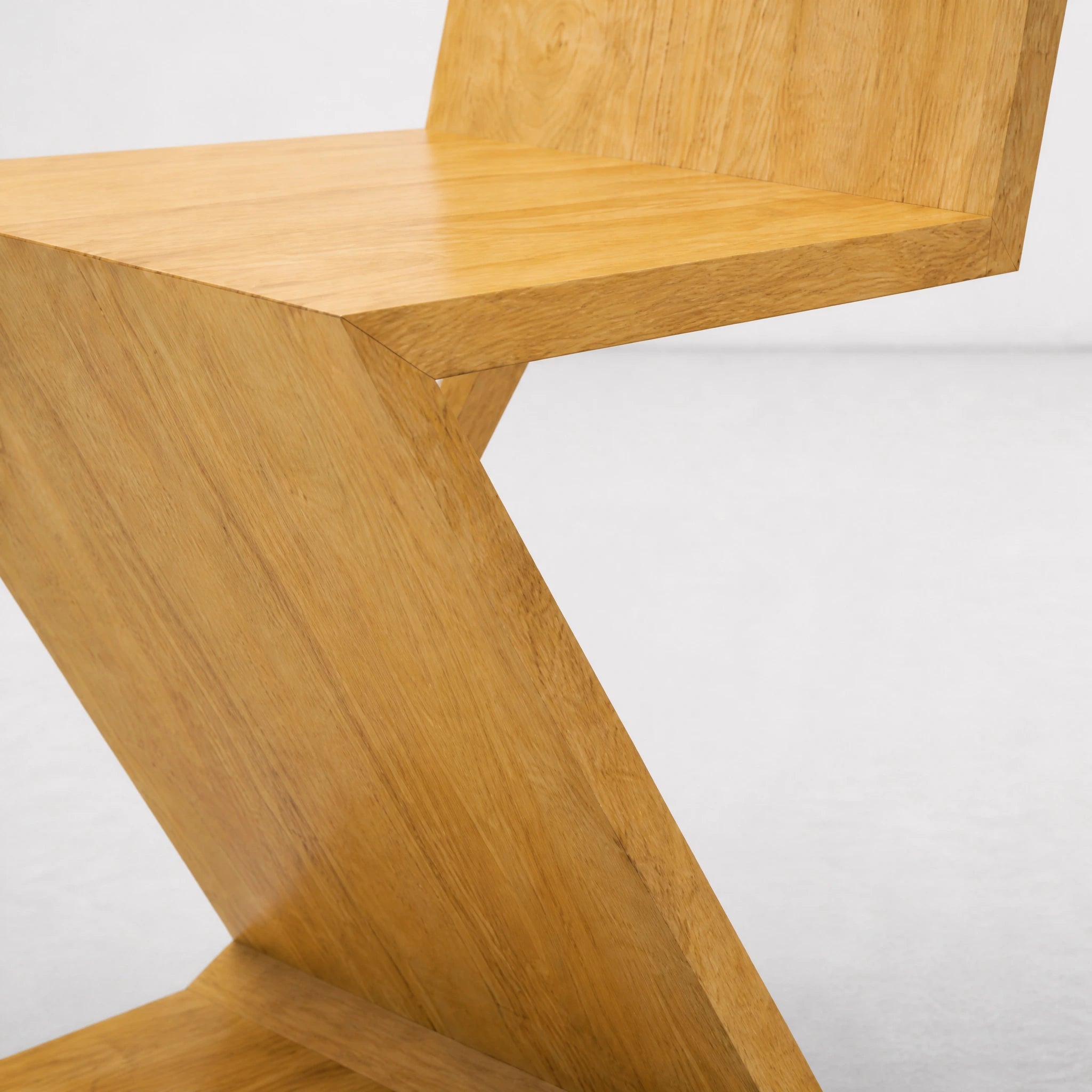 Natural Wood Zig Zag Chair detail of the wood grain and folded joinery