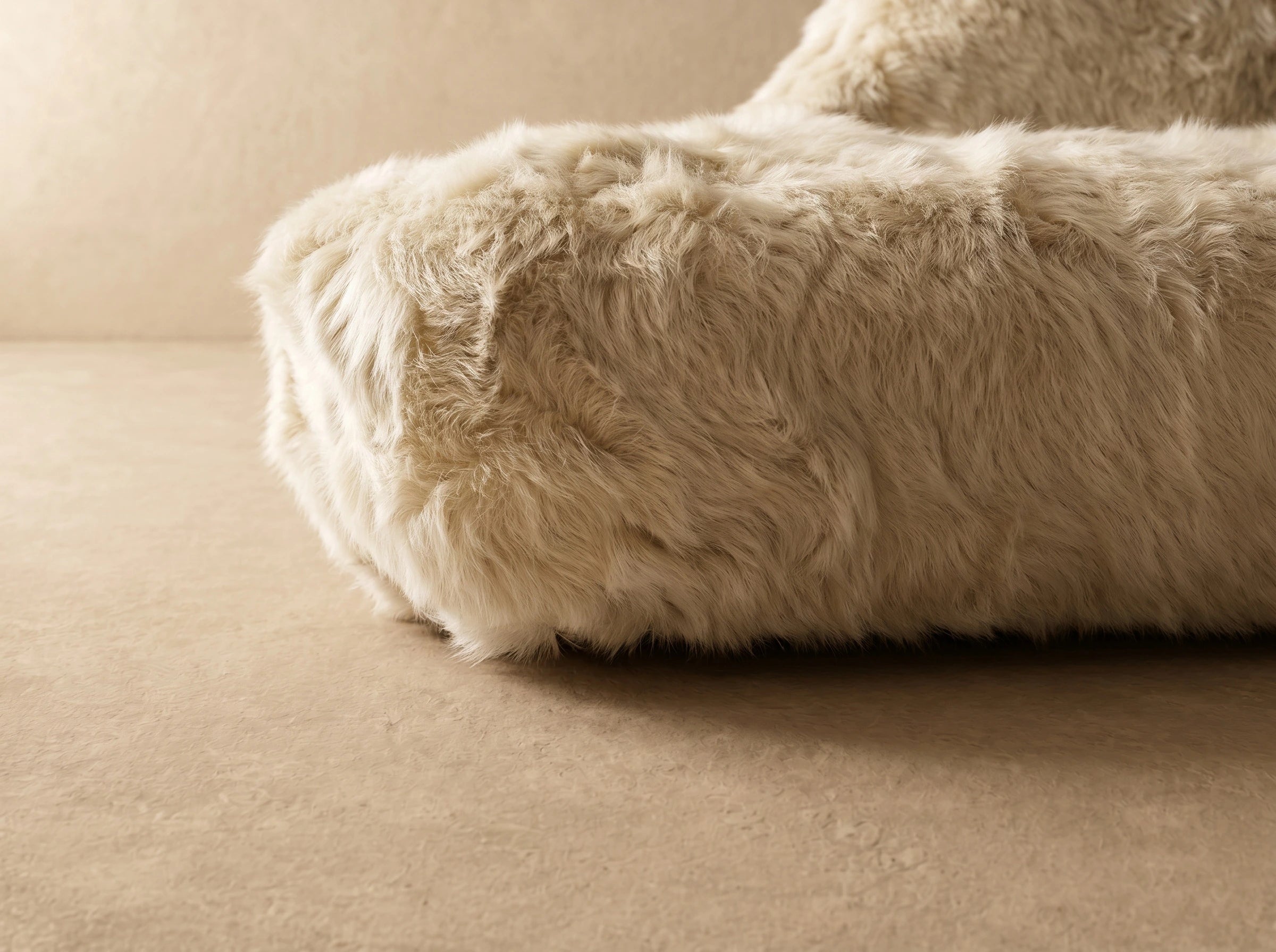 Ivory cream shaggy faux fur organic boulder sofa, angled detail