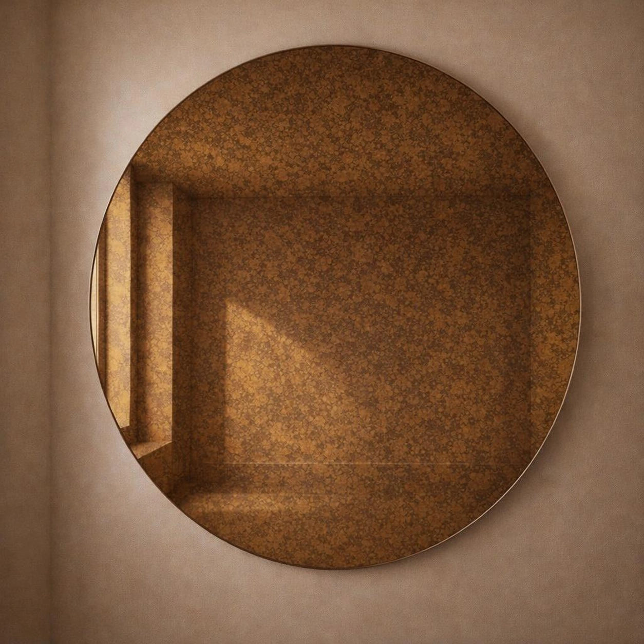 Amber cognac antiqued round wall mirror, angled view showing warm foxing
