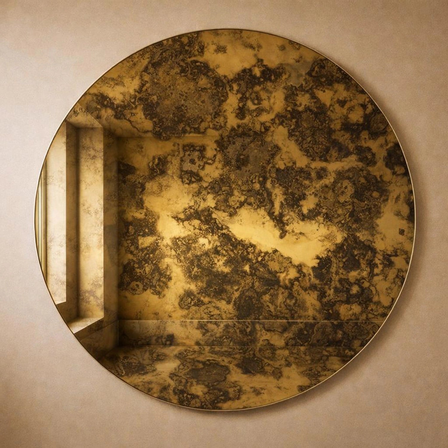 Gold antiqued round wall mirror with gilded foxing, full frame