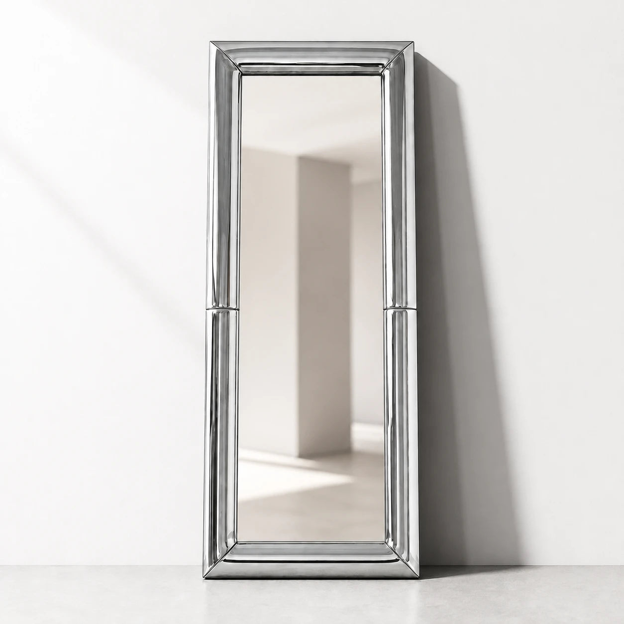 Atrium chrome full-length floor mirror in a softly lit modern interior