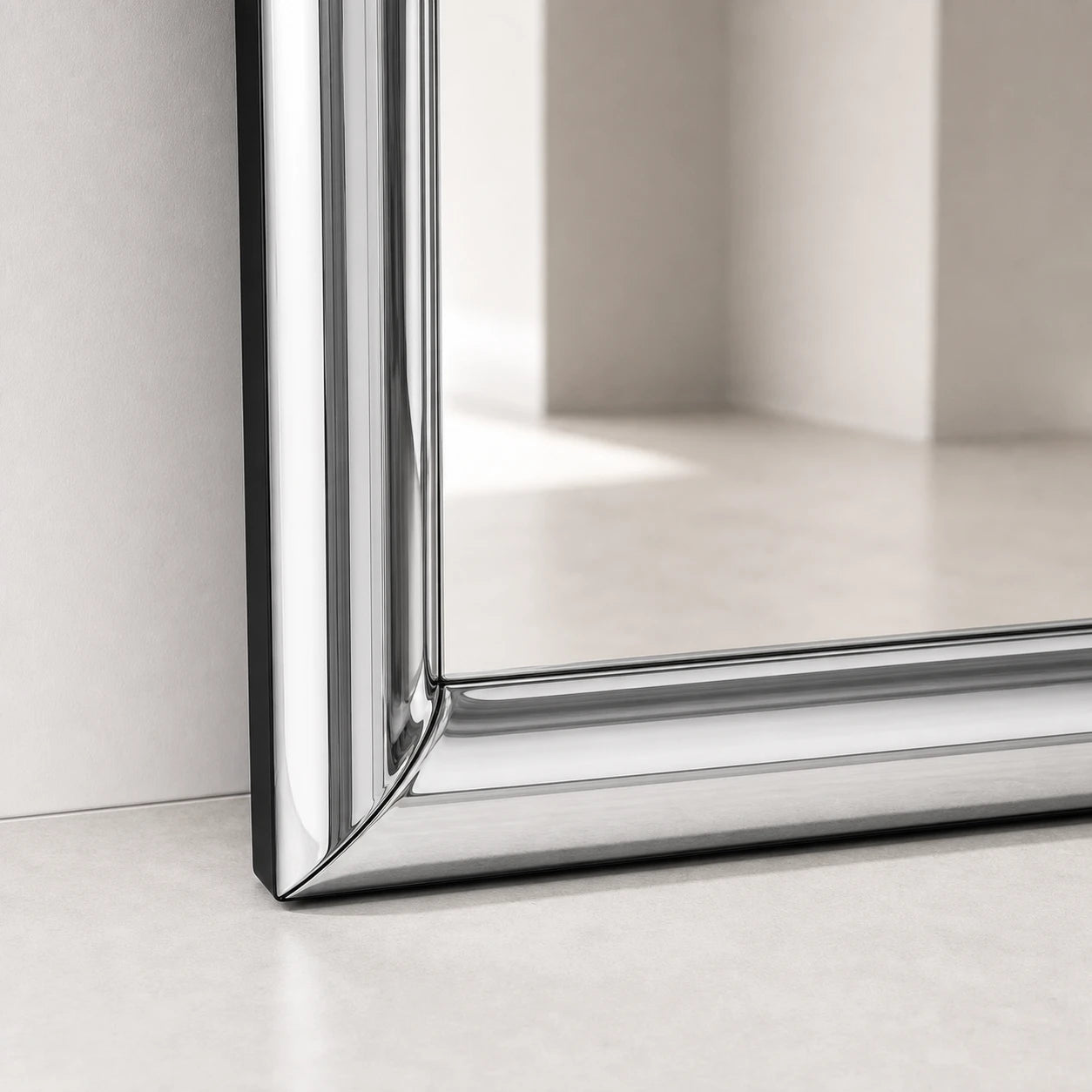 Close-up of the Atrium Floor Mirror lower corner and floor contact