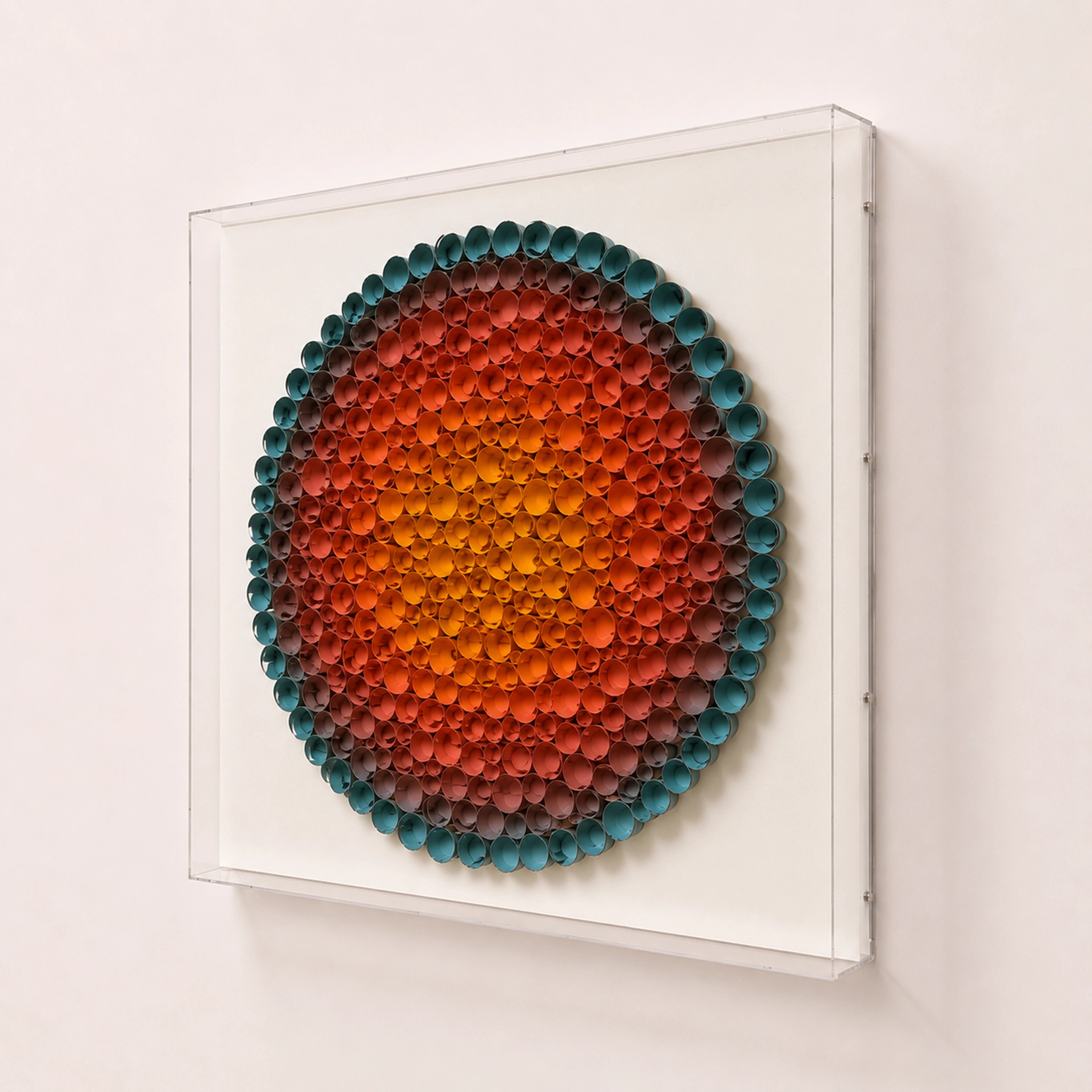Coronal Bloom — orange and blue round paper wall art in a clear acrylic shadow box — three-quarter angle
