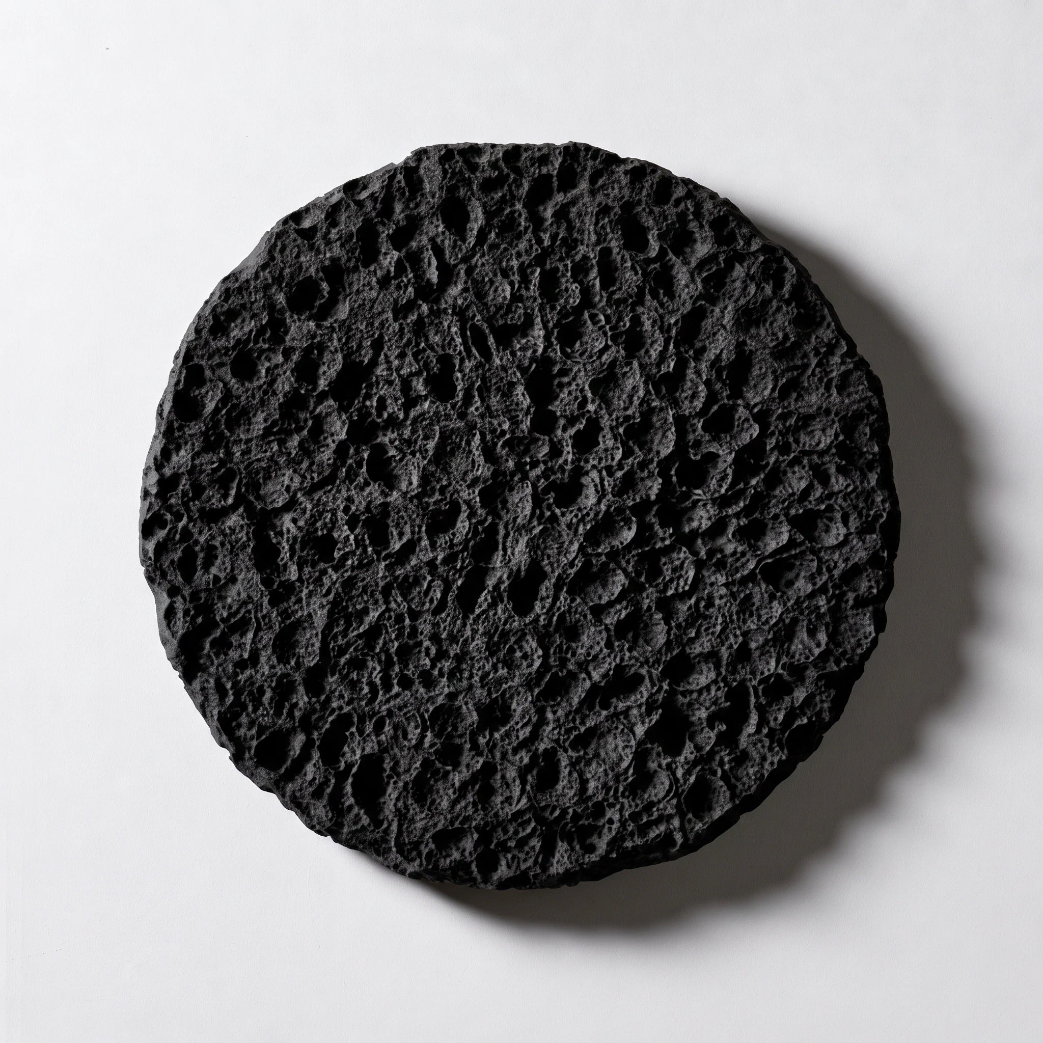 Erosion Obsidian Void matte black round wall art, straight-on hero view