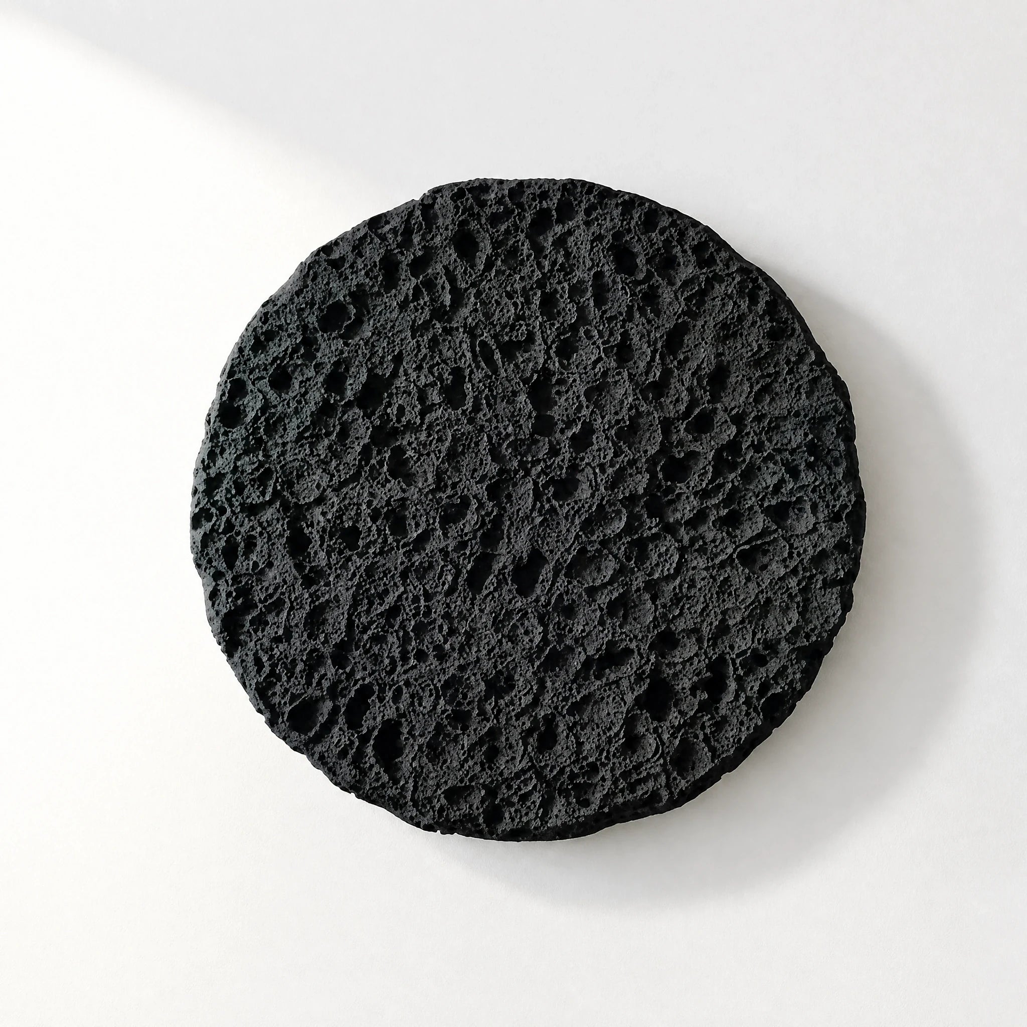 Erosion Obsidian Void matte black wall art with directional light across the relief