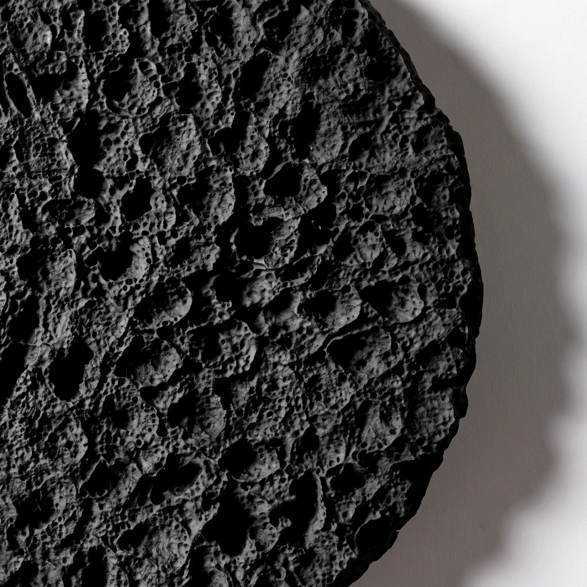 Tight surface detail of the cavities, ridges, and matte black finish