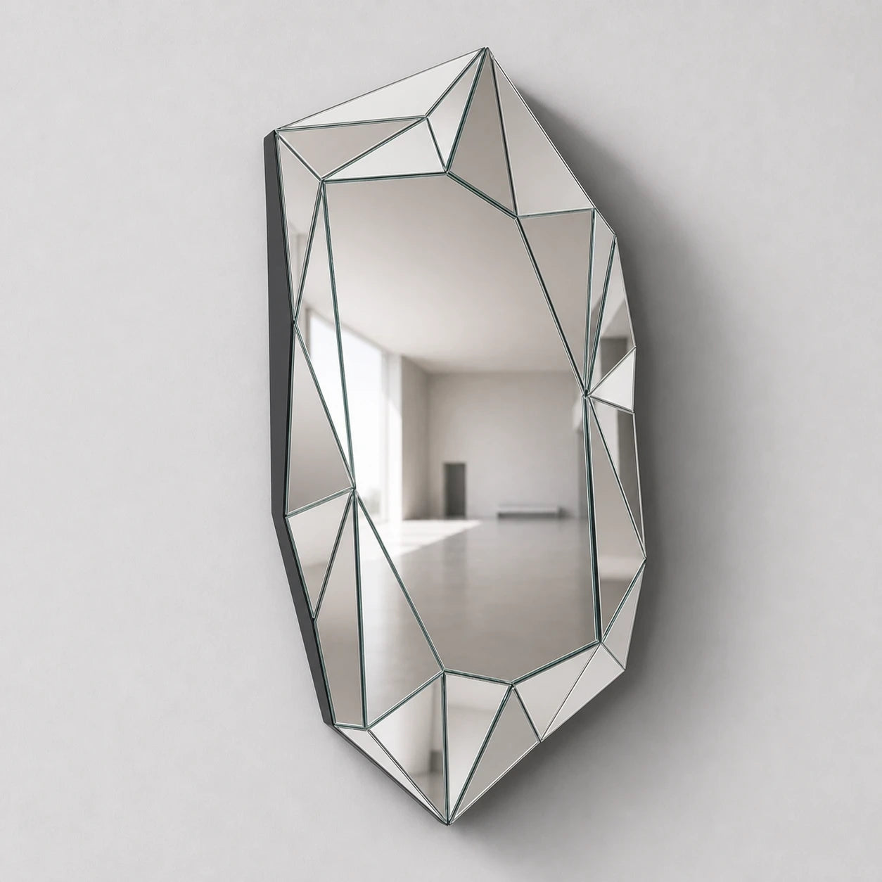 Large silver faceted wall mirror, left oblique view