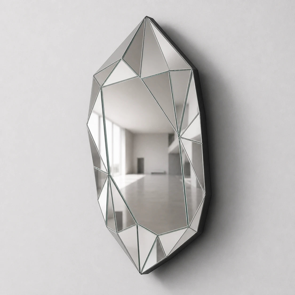 Large silver faceted wall mirror, right oblique view