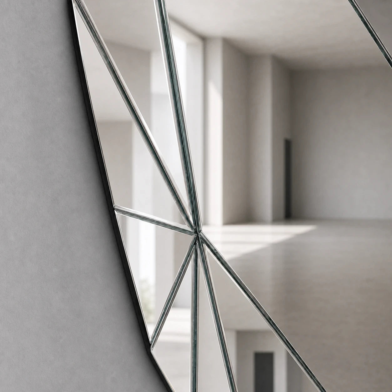 Close-up of polished silver mirror facets and glass edges
