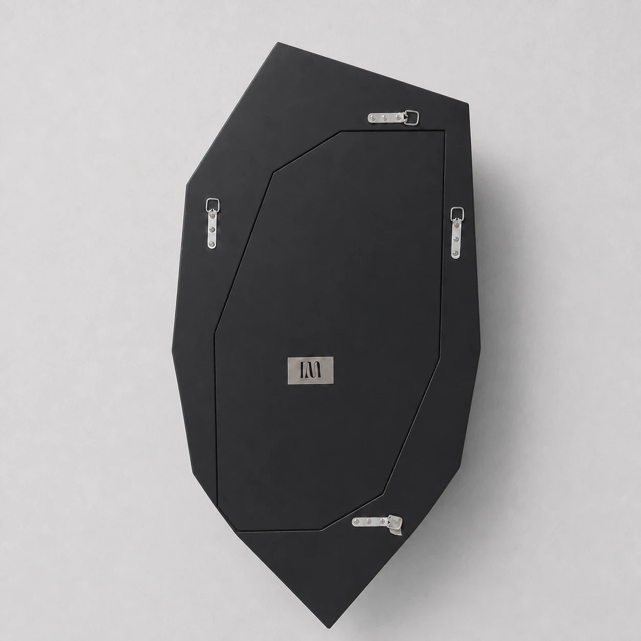 Matte-black rear backing and hanging hardware of the Geode Mirror