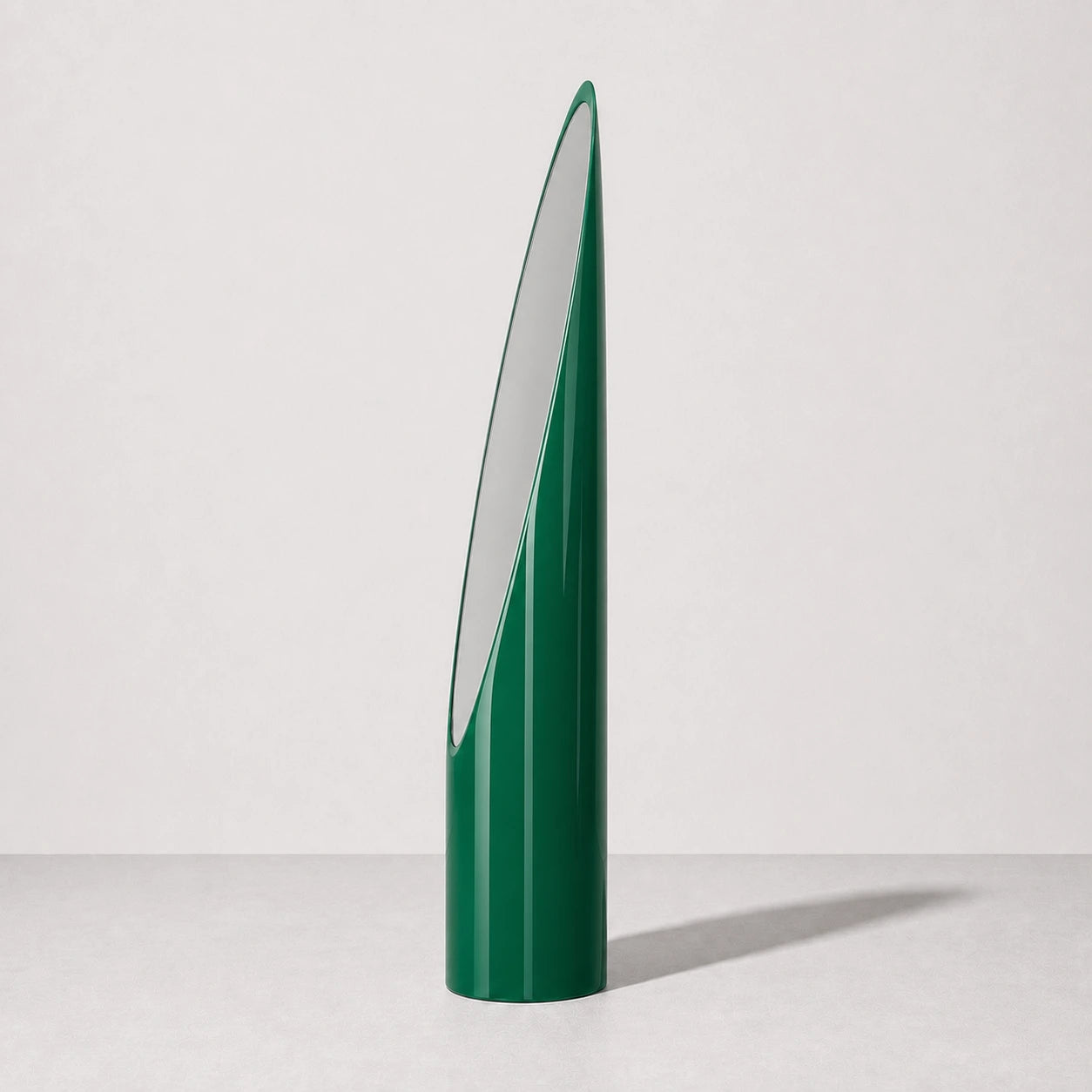 Green sculptural Lipstick floor mirror, right three-quarter studio view