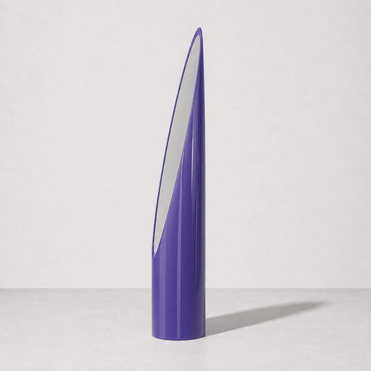 Purple sculptural Lipstick floor mirror, right three-quarter studio view