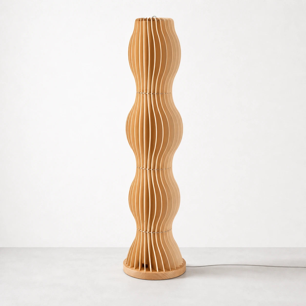 Brown slatted wood floor lamp on warm off-white studio background