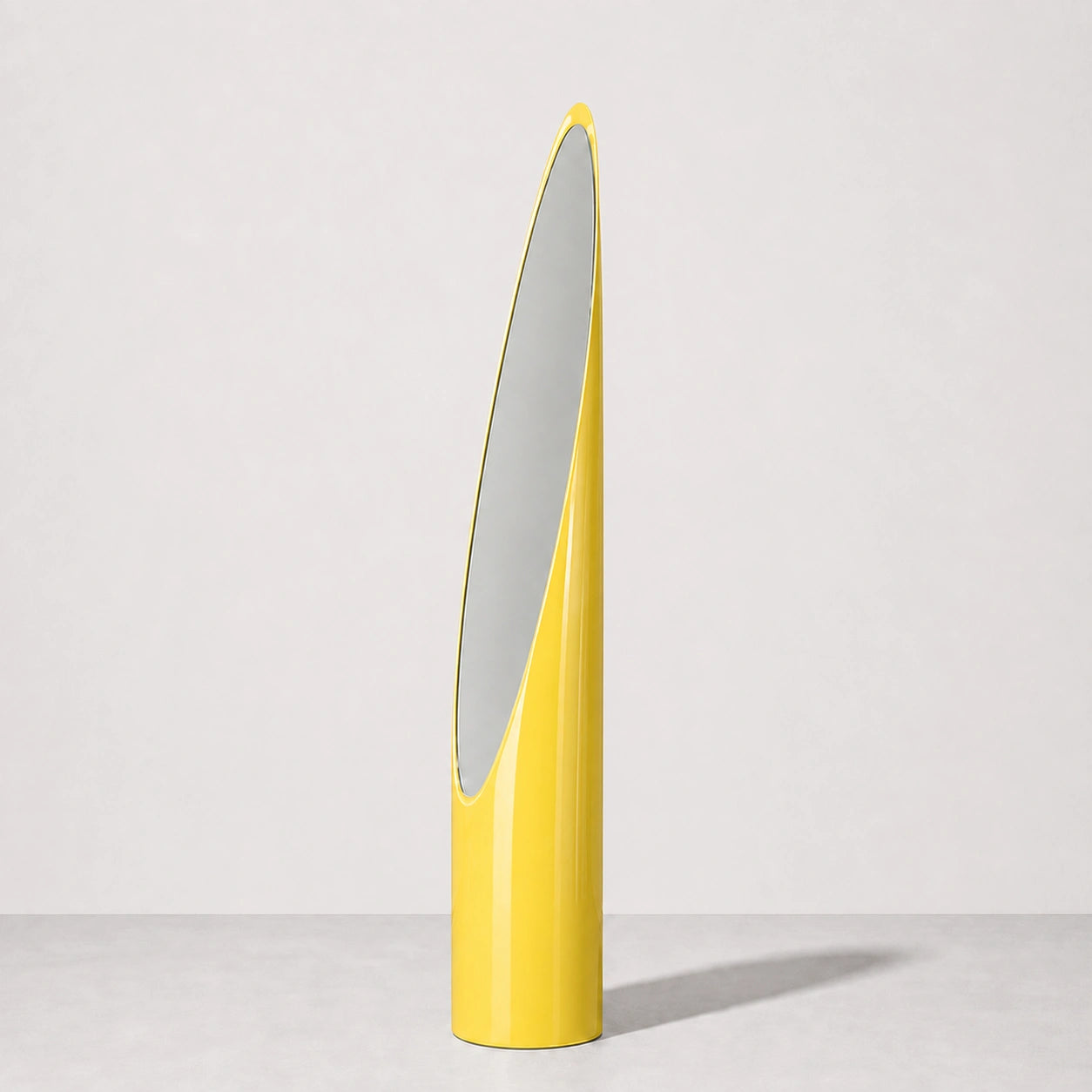 High-gloss yellow Lipstick floor mirror in a warm neutral studio, front hero view